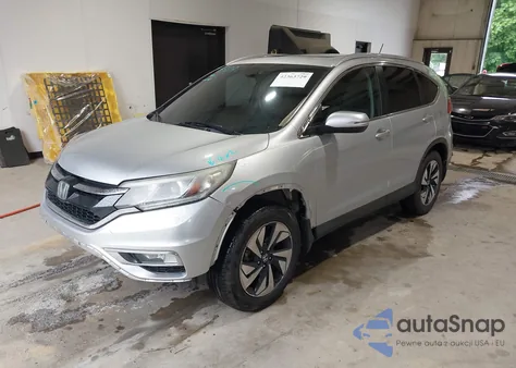 2015 Honda Cr-V Touring z USA, uszkodzony, nr VIN 5J6RM4H91FL120929
